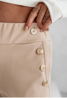 Materiałowe spodnie z guzikami Alendra beżowe