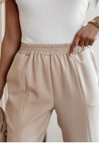 Materiałowe spodnie z rozcięciami She's Boss beżowe