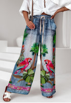 Materiałowe spodnie wide leg we wzory Jungle Expression niebieskie