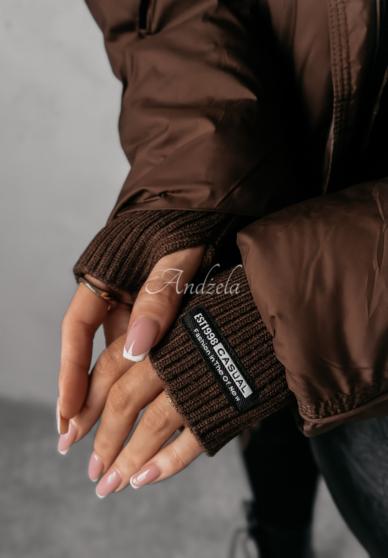 Aurora Skies chocolate down jacket with hood.