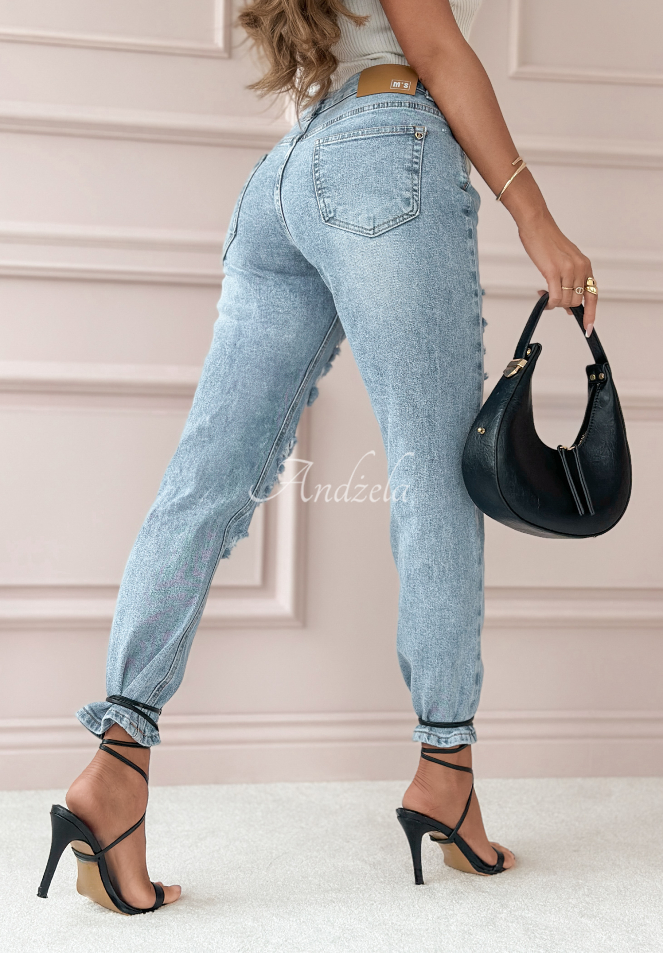 Greatest Joy light blue denim pants with rubbed edges