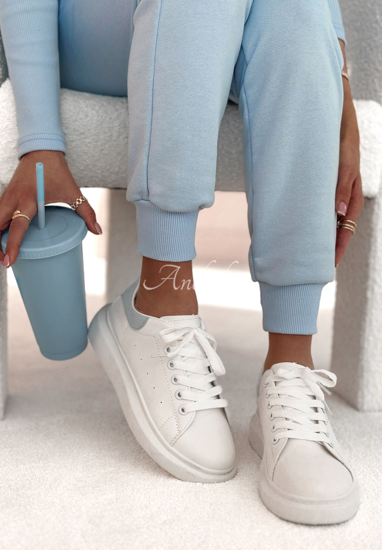 Get A Little Lost white and blue sneakers