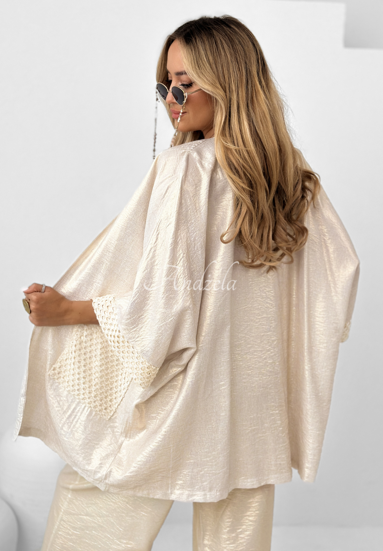 Oceanic Crest gold cardigan with openwork pockets