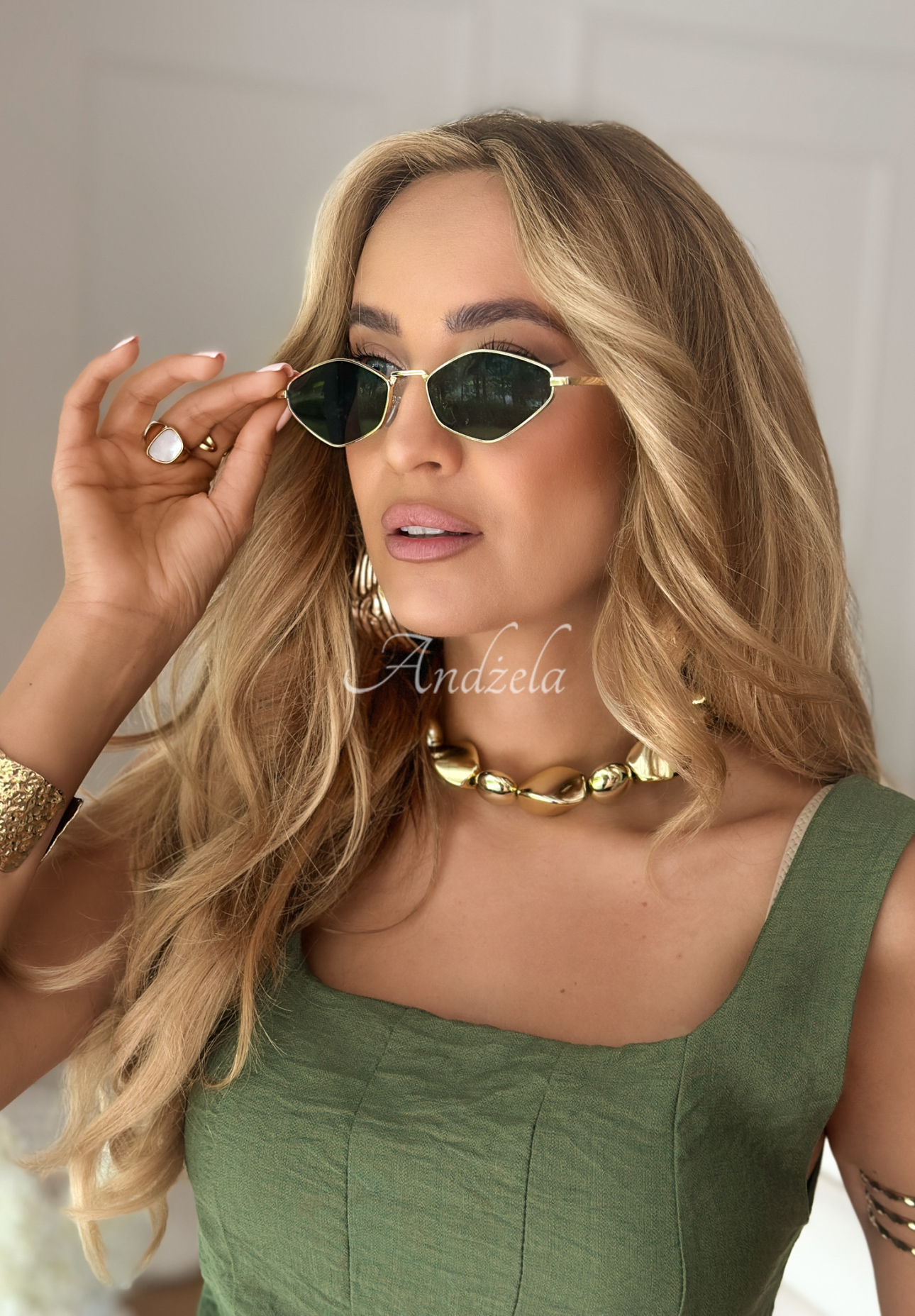 Vision Wave gold and black sunglasses.