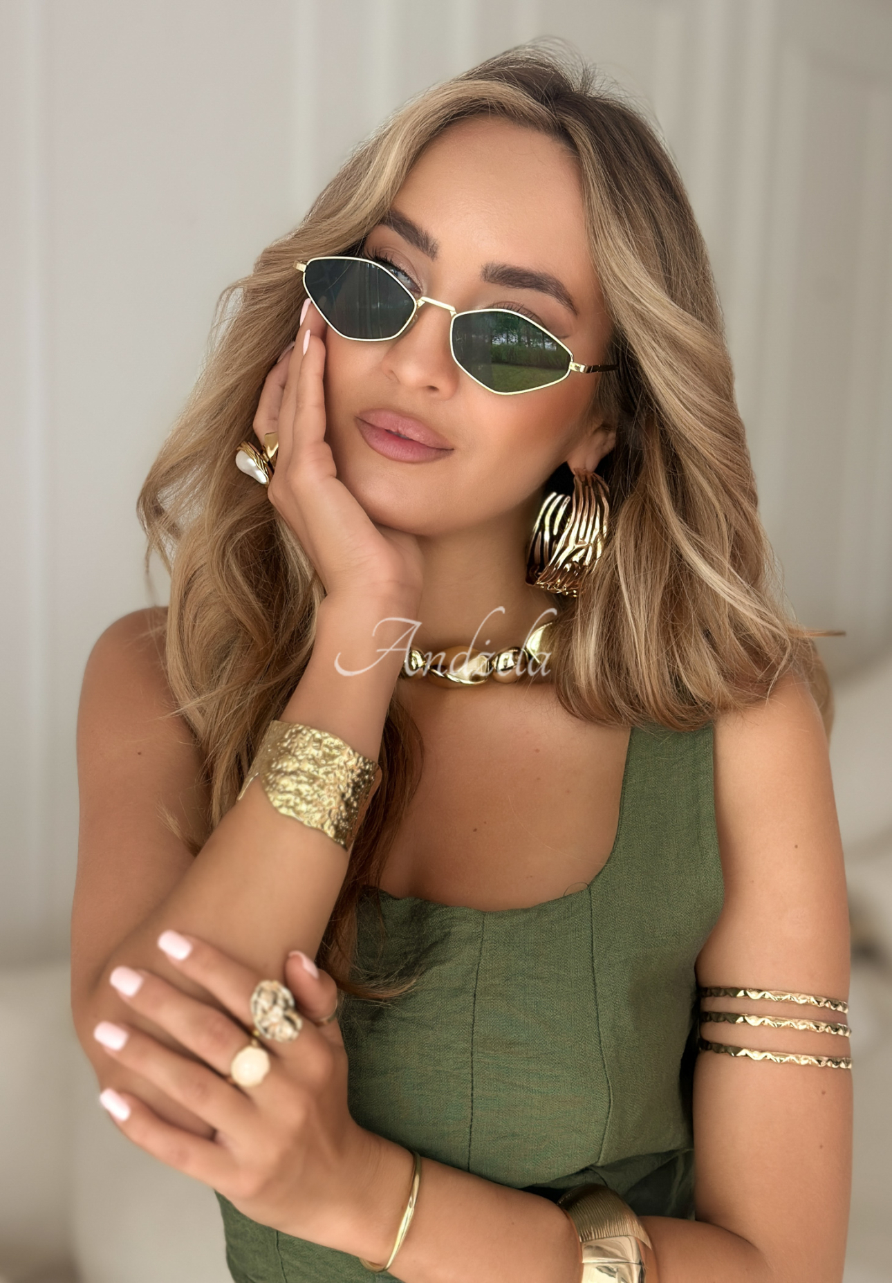 Vision Wave gold and black sunglasses.