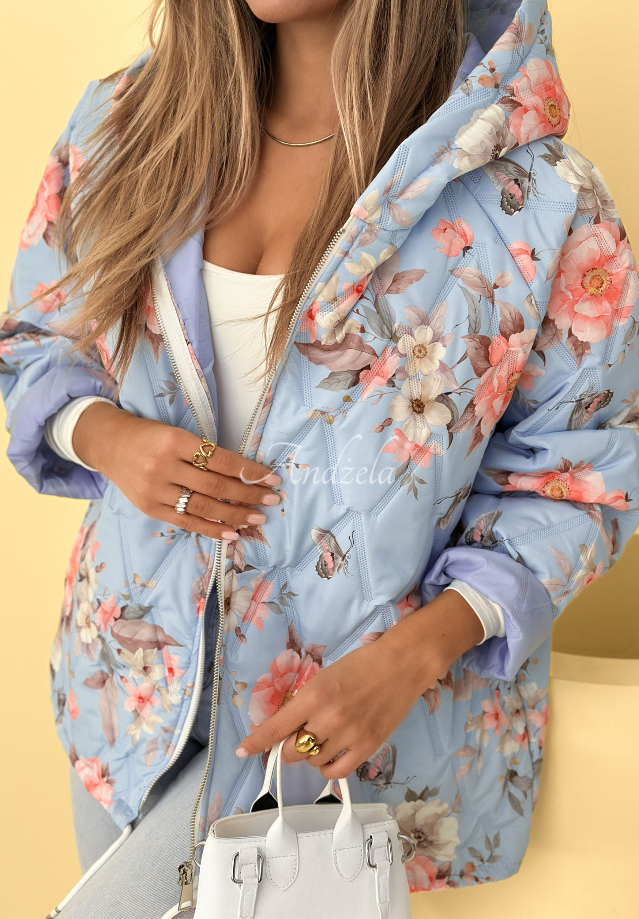 Short quilted jacket with hood in blue Begonia flowers