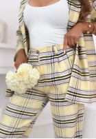 Materiałowe spodnie w kratę z paskiem Her Decision pudrowy róż