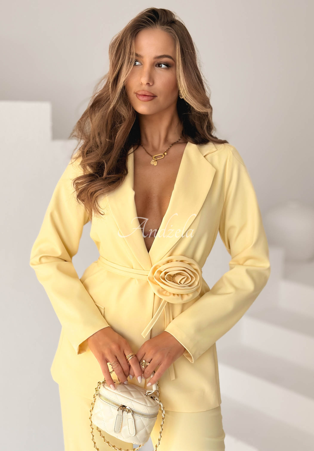 Elegant women's suit with a yellow Tessa flower