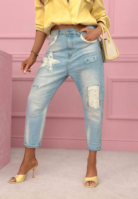 Blue mom-fit jeans with Place Like This patches