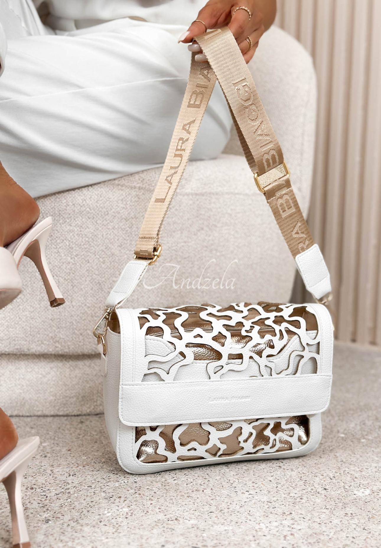 Rosanna White Leather Handbag with Openwork Design and Gold Accents