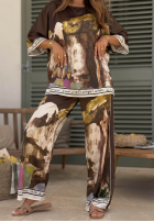 Satynowy komplet bluzka i spodnie wide leg we wzory Solene pistacjowy