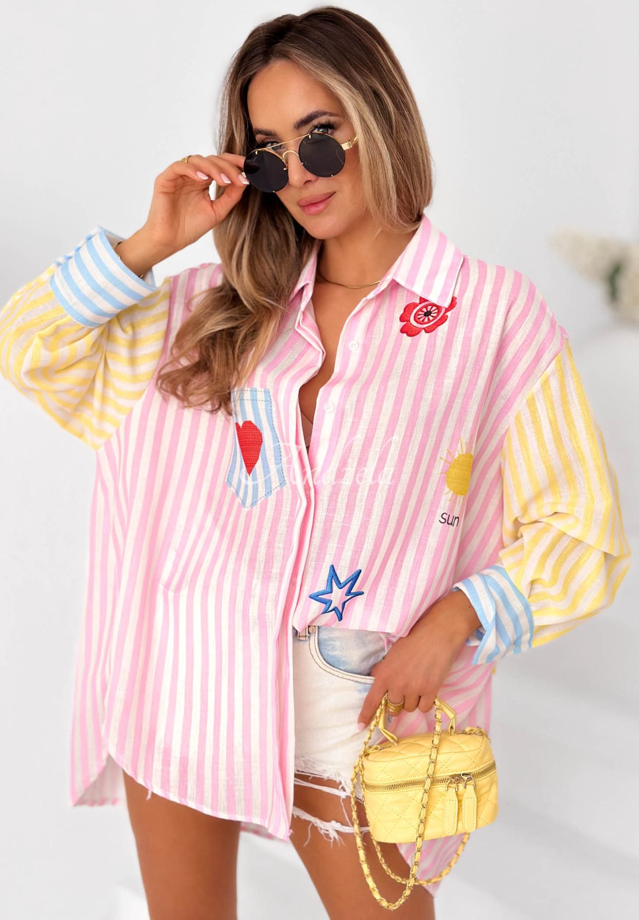 Pink and yellow striped linen shirt with "Sun &amp; Stripes" print