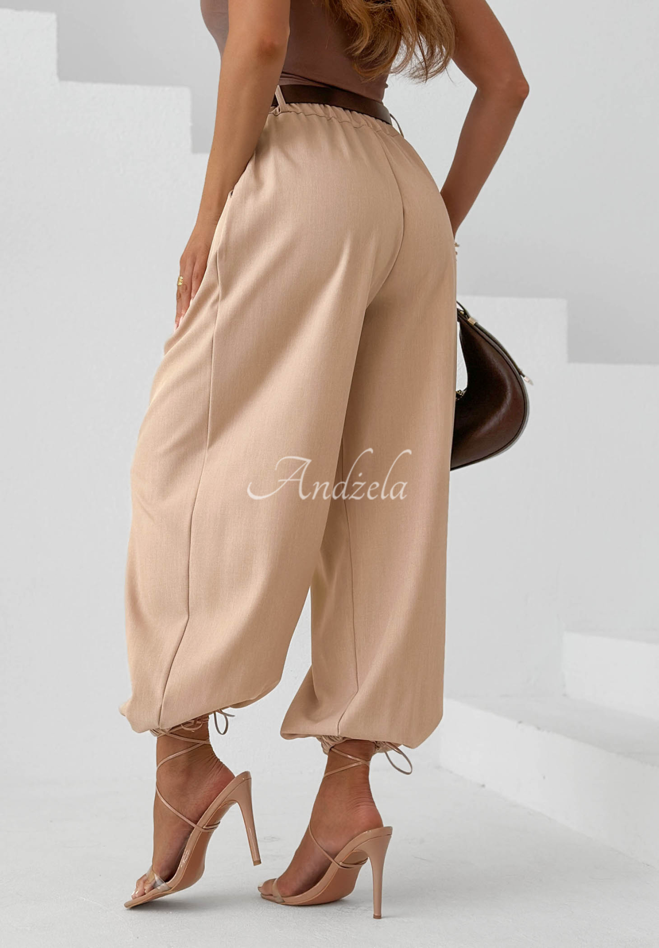 Elegant beige Desert City jogger pants with a belt