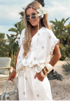 Materiałowe spodnie wide leg we wzory Sunset Paradise biało-beżowe