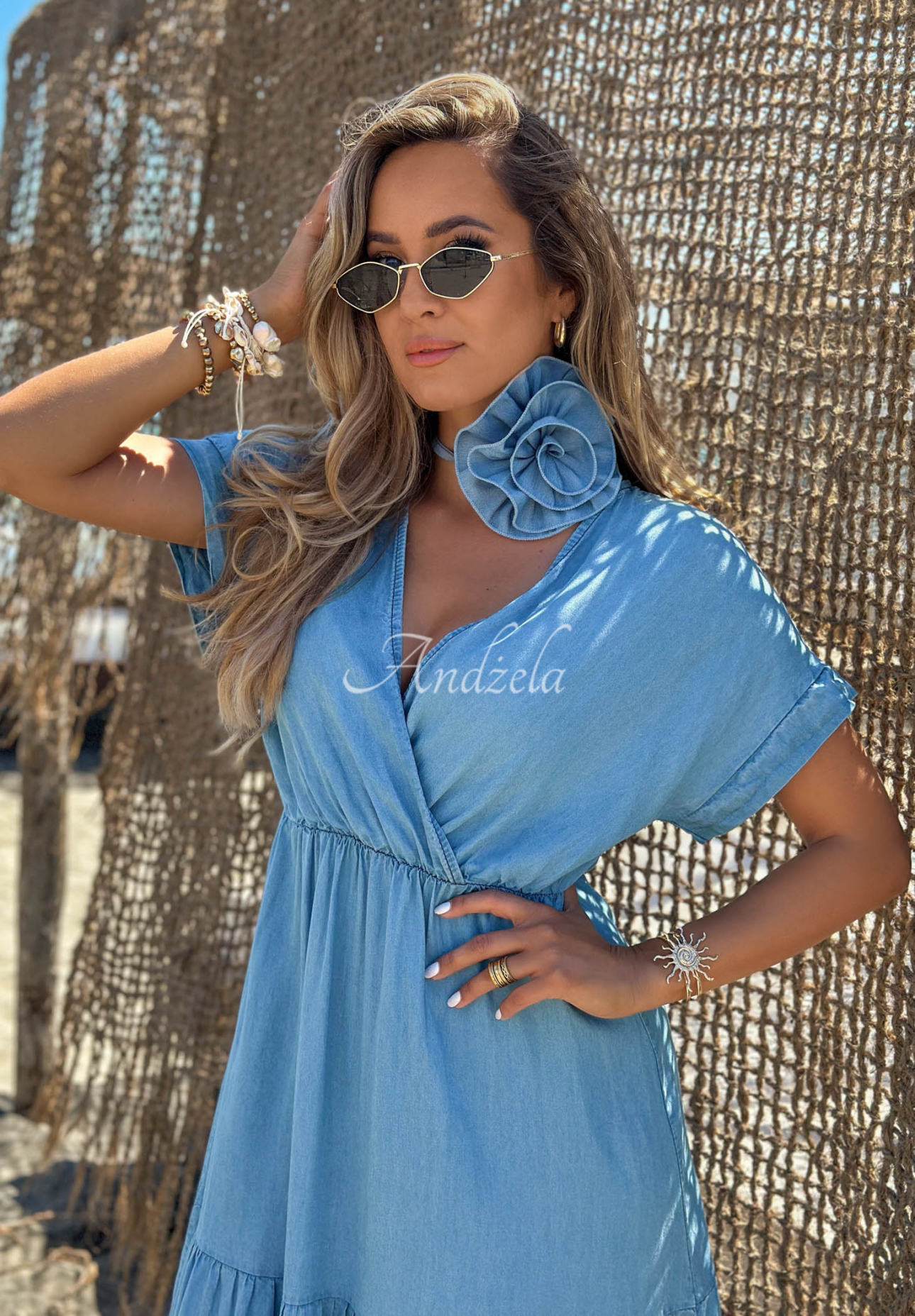 Light blue Rosa Sea lyocell dress with ruffles and a rose-patterned belt