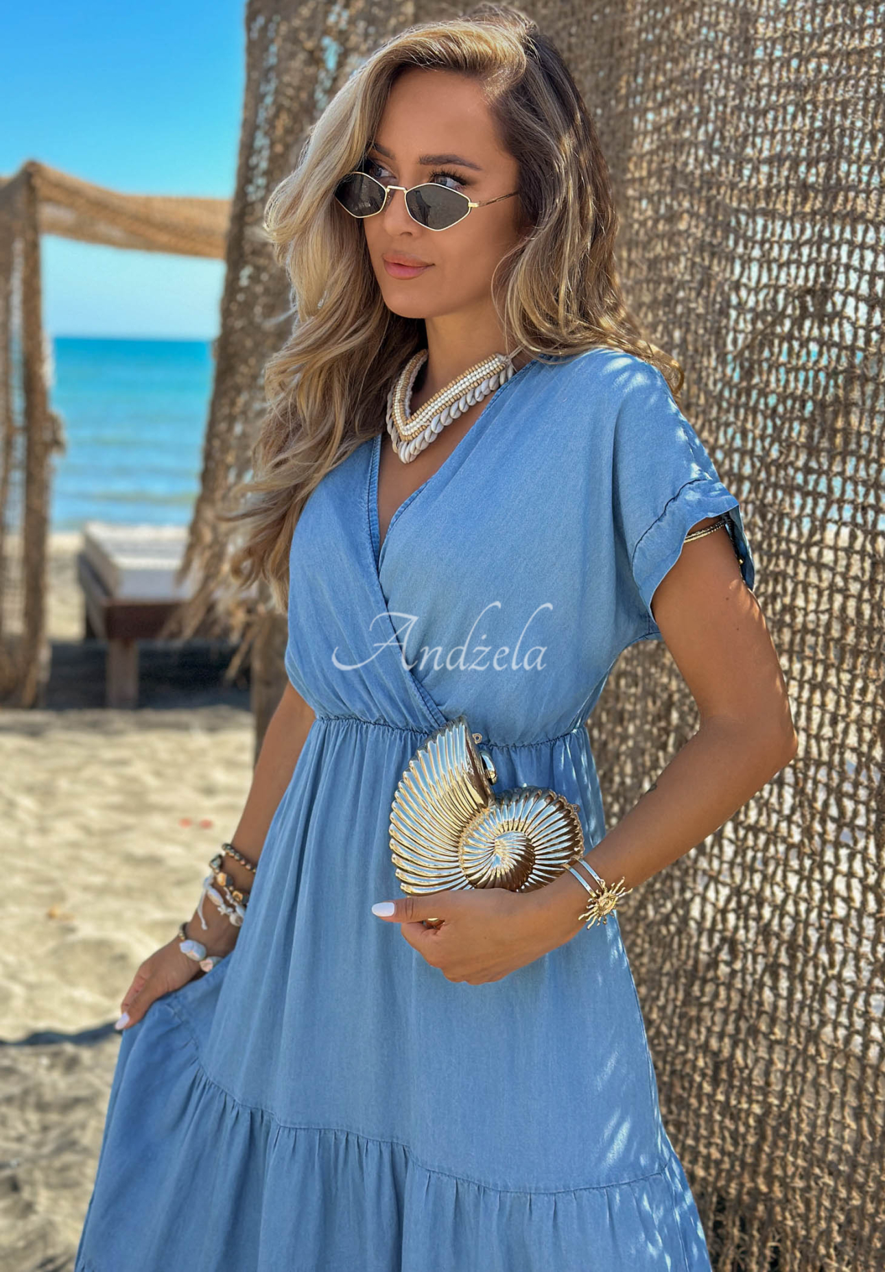 Light blue Rosa Sea lyocell dress with ruffles and a rose-patterned belt