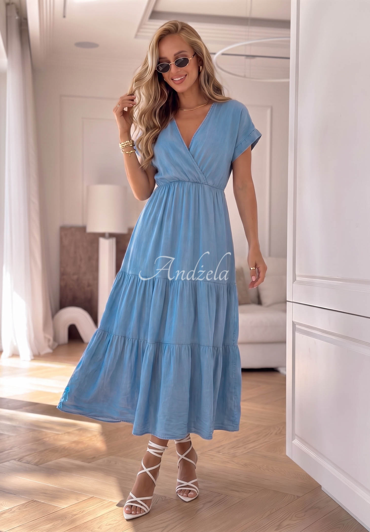 Light blue Rosa Sea lyocell dress with ruffles and a rose-patterned belt