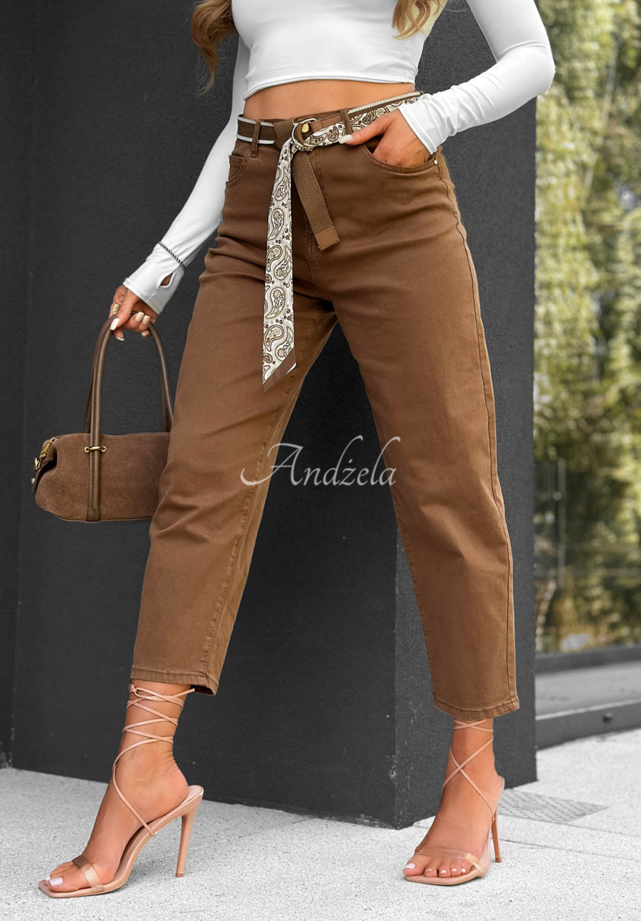 Camel-colored Sun Fade mom-fit jeans with a belt