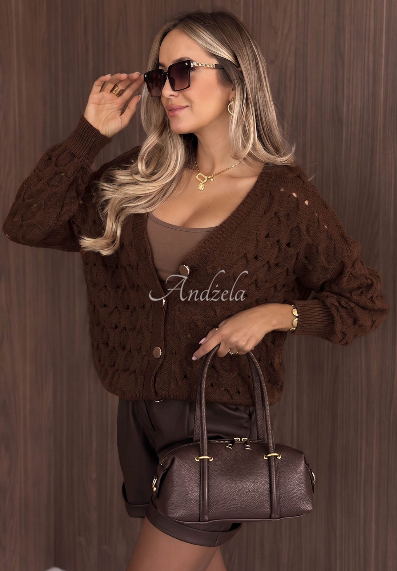 Short openwork cardigan with a front closure by Knit Haven in camel