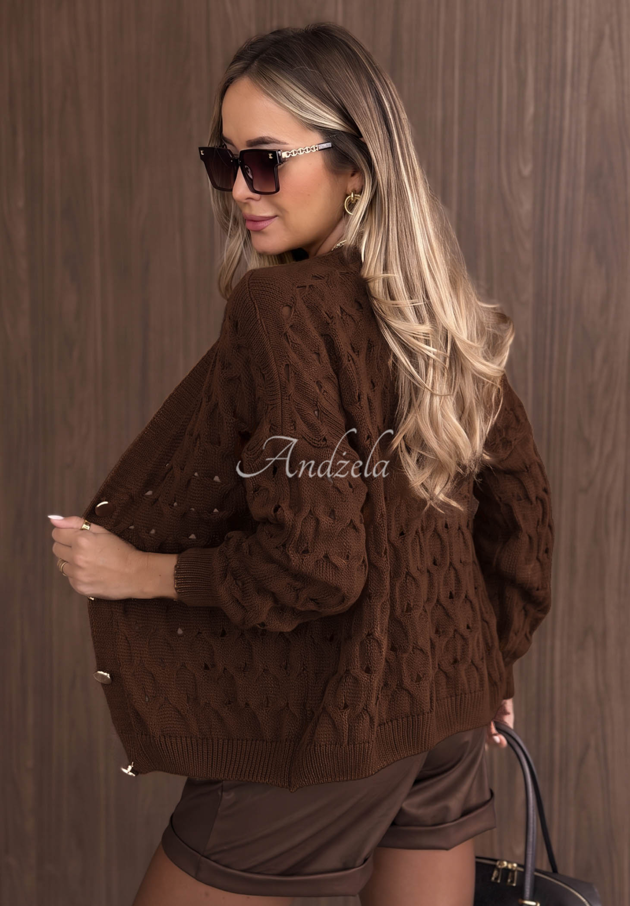 Short openwork cardigan with a front closure by Knit Haven in camel